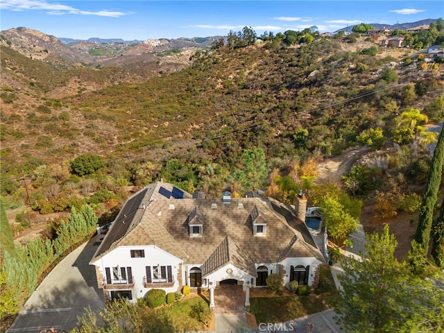 drone / aerial view featuring a mountain view