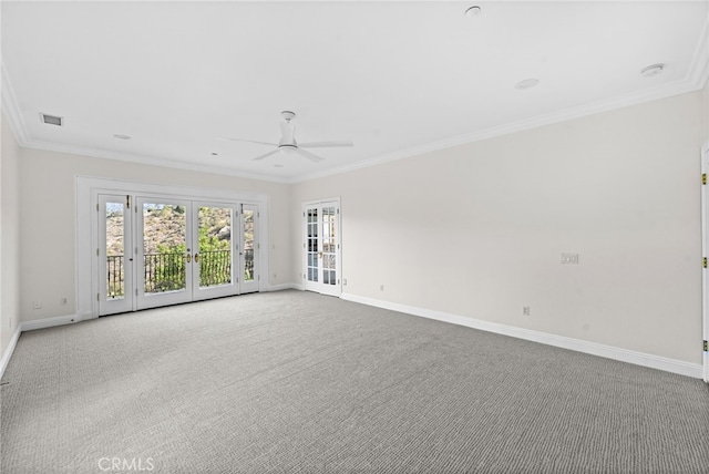 empty room with ceiling fan, light colored carpet, ornamental molding, and french doors