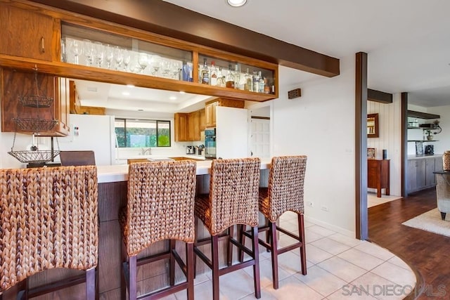 tiled dining space featuring sink