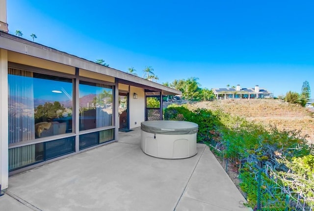 view of patio with a hot tub