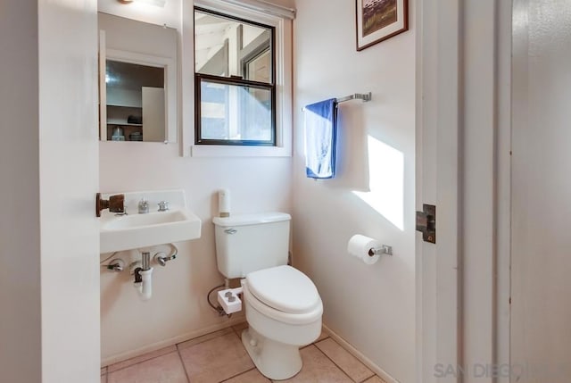 bathroom featuring tile patterned floors and toilet