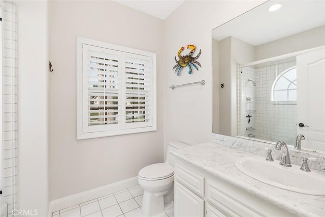 bathroom with toilet, tile patterned floors, and vanity