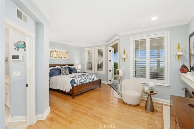 bedroom with light wood-type flooring and ornamental molding