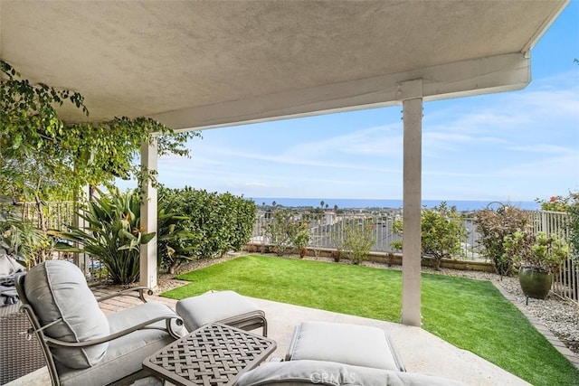 view of patio with a water view