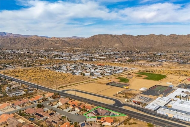 birds eye view of property featuring a mountain view