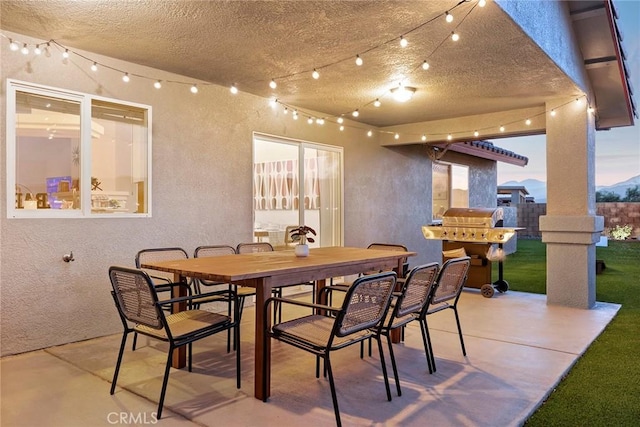 dining space featuring concrete flooring and a textured ceiling