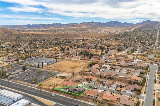 birds eye view of property featuring a mountain view