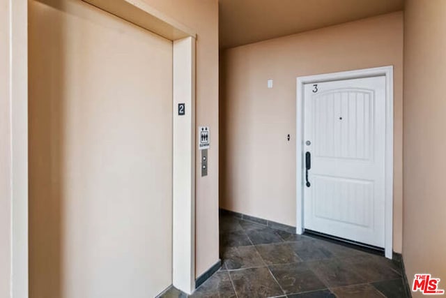 doorway to property with elevator