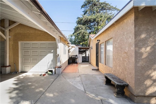 view of side of property with a garage