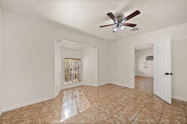 tiled spare room with an AC wall unit and ceiling fan