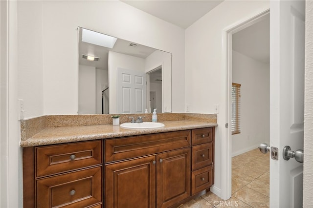 bathroom with vanity and tile patterned floors