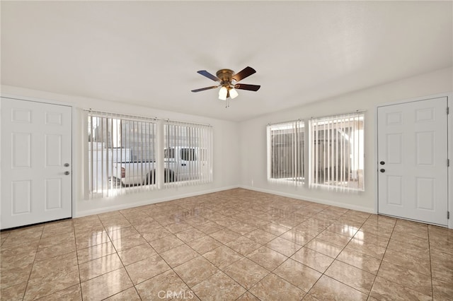 entrance foyer with ceiling fan and light tile patterned flooring