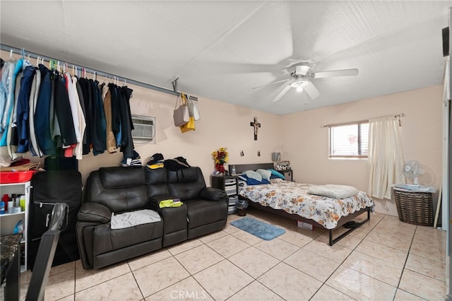 tiled bedroom featuring ceiling fan