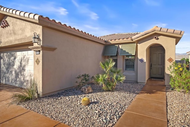 entrance to property featuring a garage