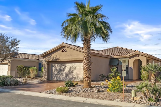 mediterranean / spanish-style house featuring a garage