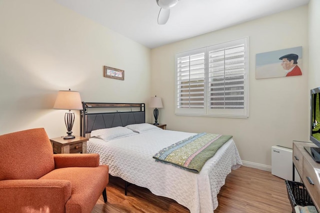 bedroom featuring ceiling fan and light hardwood / wood-style floors