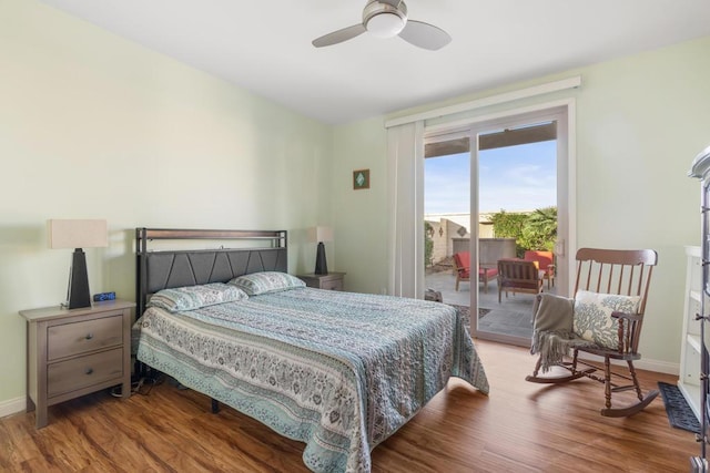 bedroom with access to exterior, ceiling fan, and wood-type flooring