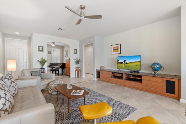 tiled living room featuring ceiling fan