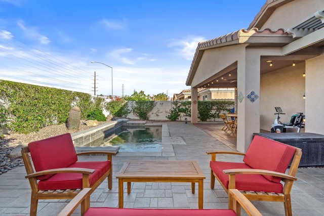 view of patio / terrace with a fenced in pool