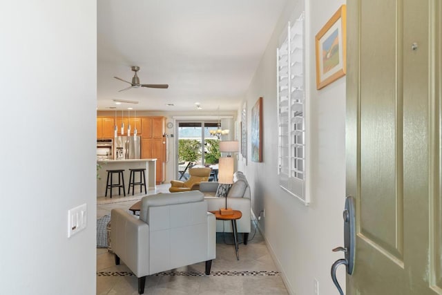 tiled living room featuring ceiling fan