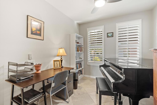 tiled office featuring ceiling fan