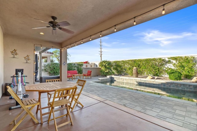 view of patio featuring ceiling fan