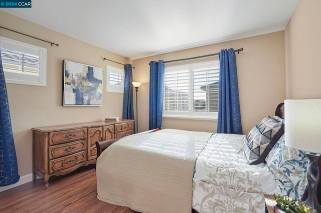 bedroom with hardwood / wood-style floors