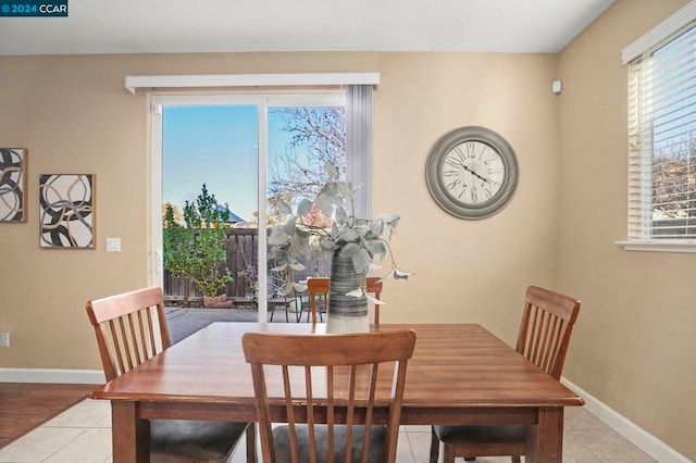 dining area featuring light tile patterned floors