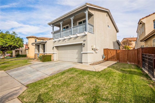 view of front of house with a balcony, a front lawn, and a garage