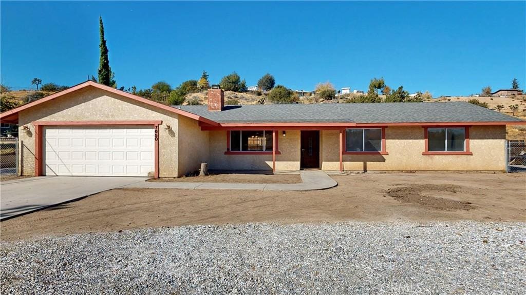 single story home with a garage