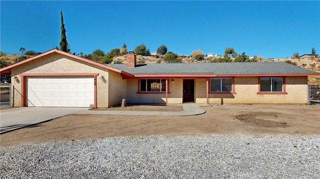 single story home with a garage