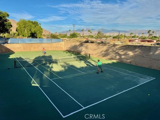 view of sport court with fence