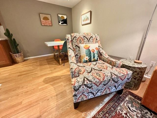 bedroom featuring baseboards and wood finished floors