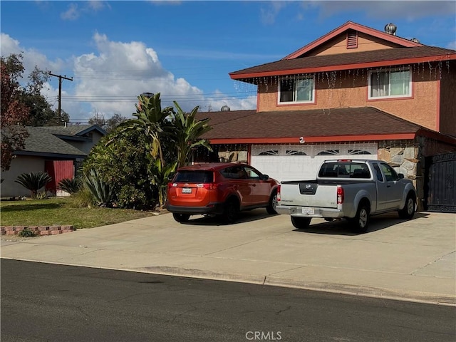 view of front of property with a garage