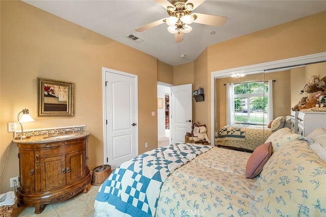 bedroom featuring light tile patterned floors, visible vents, and ceiling fan