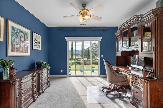 home office featuring visible vents, baseboards, a ceiling fan, and carpet flooring