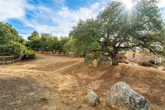 view of yard with a rural view