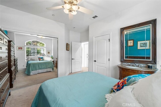 carpeted bedroom featuring ceiling fan