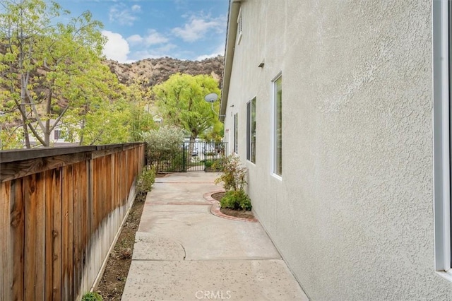 view of side of home featuring a mountain view