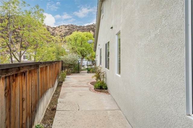 view of side of property with a mountain view