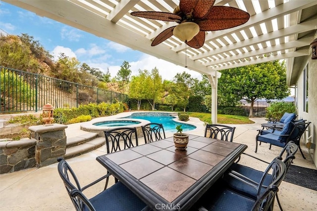 view of patio / terrace with a swimming pool with hot tub, a pergola, and ceiling fan