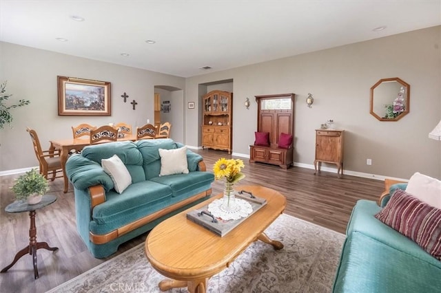 living room with dark hardwood / wood-style flooring