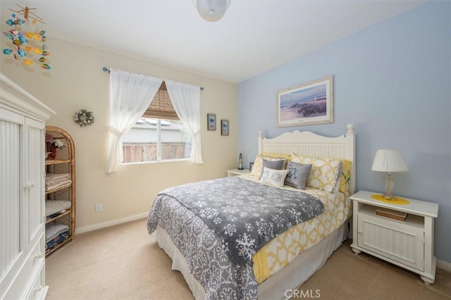 bedroom featuring light colored carpet