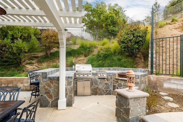 view of patio / terrace featuring an outdoor kitchen, area for grilling, exterior bar, and a pergola