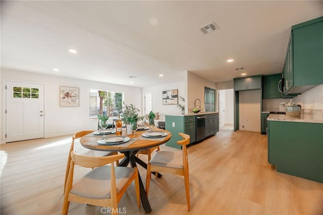 dining area with light wood-type flooring