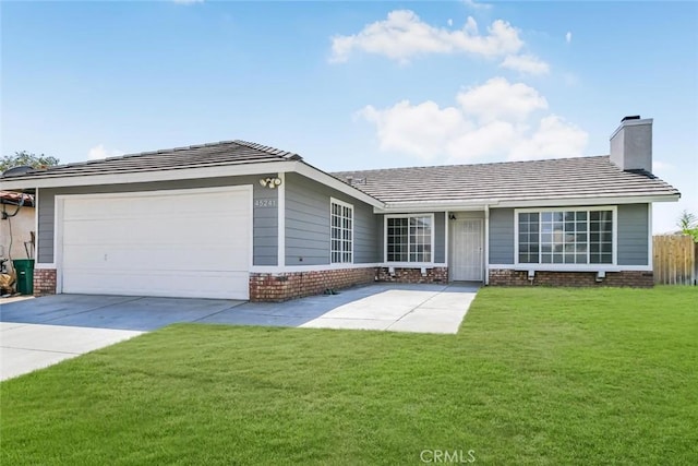 ranch-style home with a garage and a front lawn