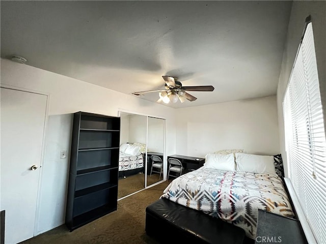 15353 El Centro Rd, Hesperia, CA 92345 - bedroom with dark colored carpet, a closet, and ceiling fan