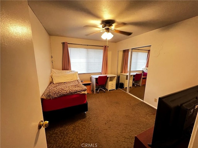 15353 El Centro Rd, Hesperia, CA 92345 - carpeted bedroom featuring a textured ceiling, ceiling fan, and a closet