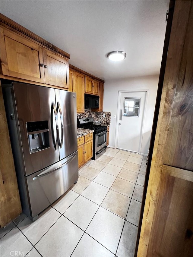 15353 El Centro Rd, Hesperia, CA 92345 - kitchen featuring appliances with stainless steel finishes, backsplash, light tile patterned floors, and brown cabinetry