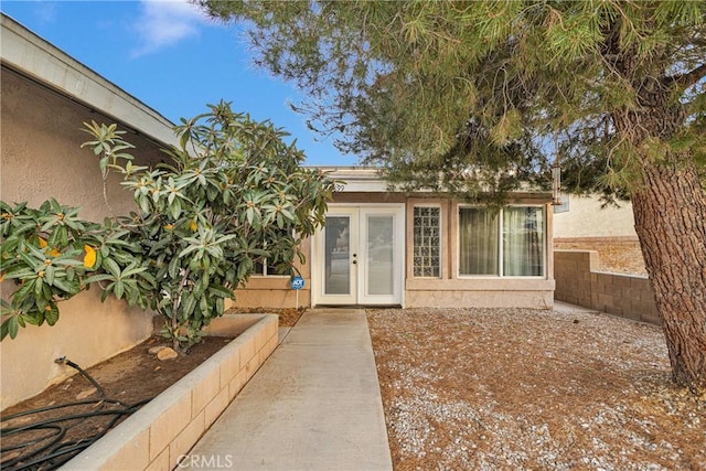 entrance to property featuring french doors